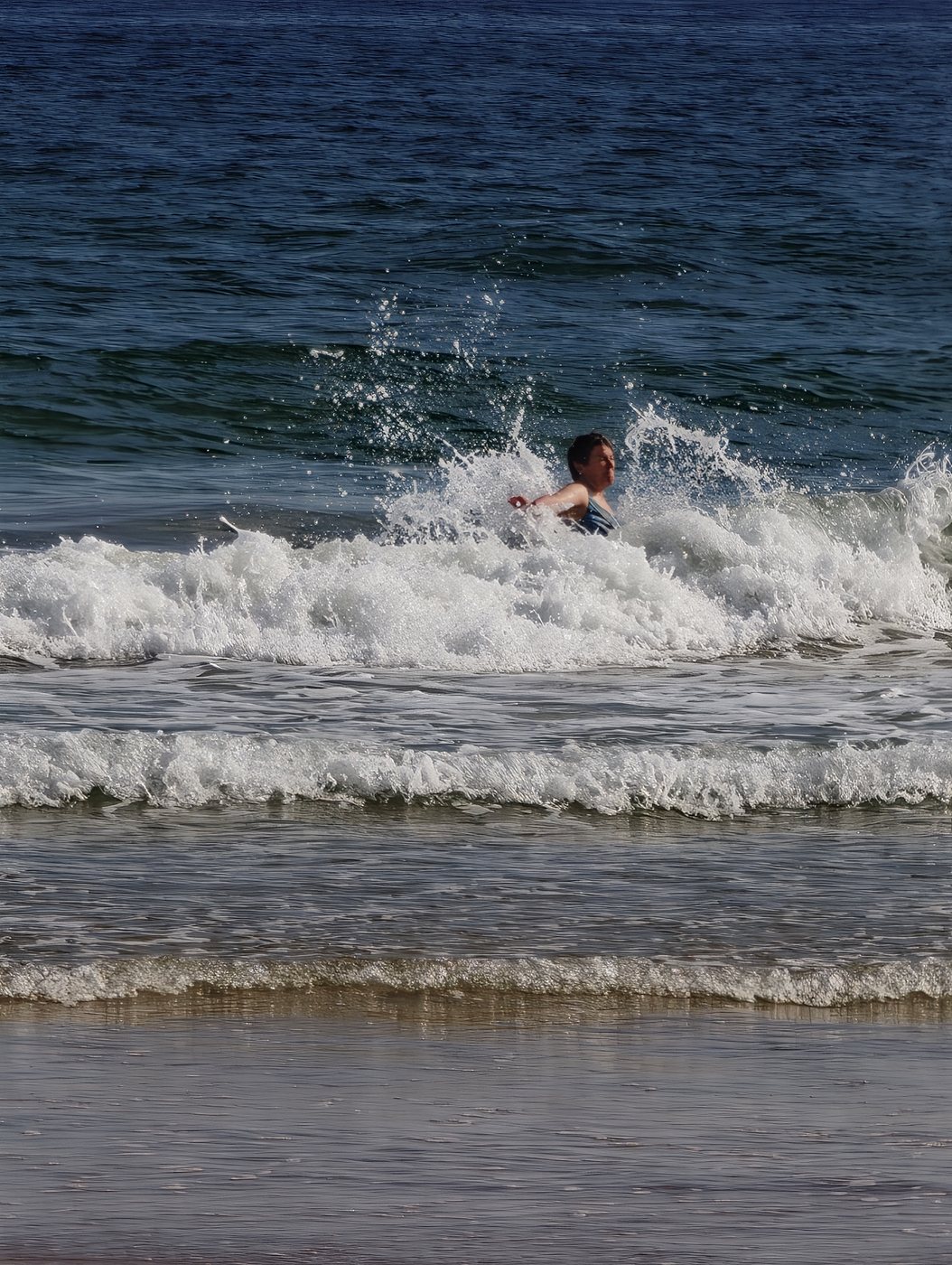 Kathy bodysurfing in the Algarve waves