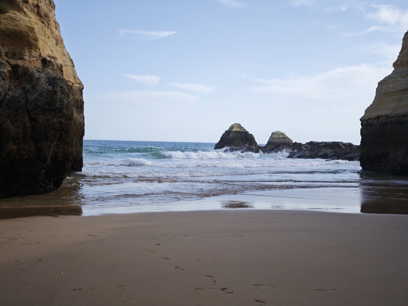 Secluded Algarve cove framed by sandstone cliffs