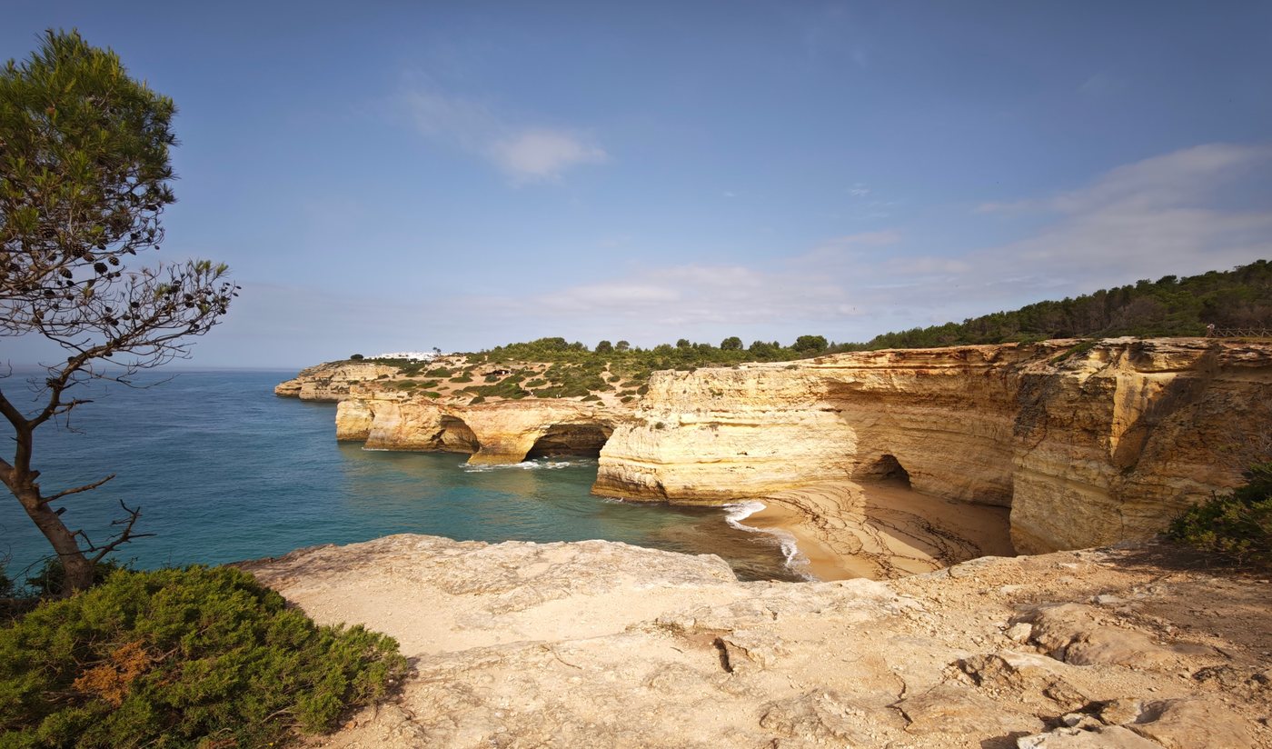 Limestone cliffs with sea arches and hidden beach below